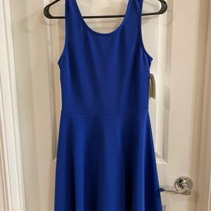 Blue sleeveless dress with bow detail